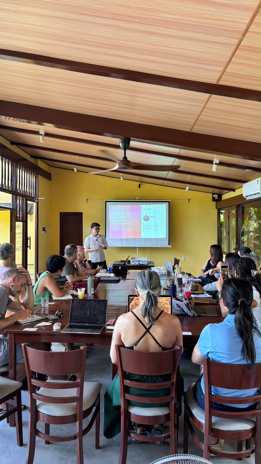 Women collaborating on laptops during a meetup